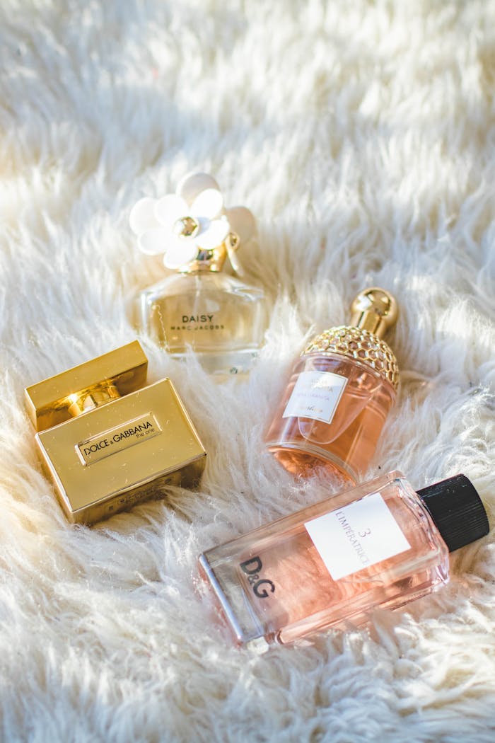 Mastering the First Impression: Your intriguing post title goes here A collection of elegant perfume bottles arranged on a plush fur surface, showcasing luxury and sophistication.